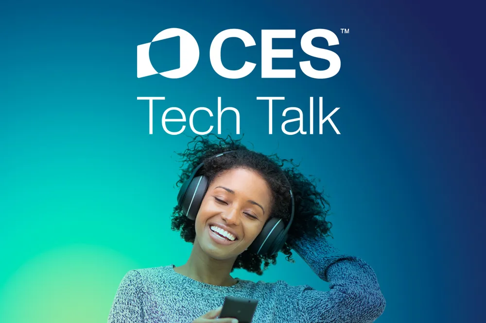 Alt: A woman with headphones smiling with a green to blue gradient with the CES Tech Talk logo above